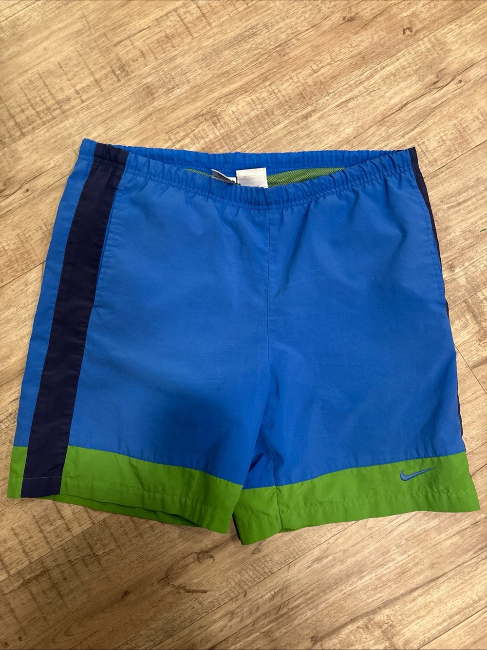 Vintage Nike Men’s Blue Swim Trunks with Green Hem and Navy Stripe